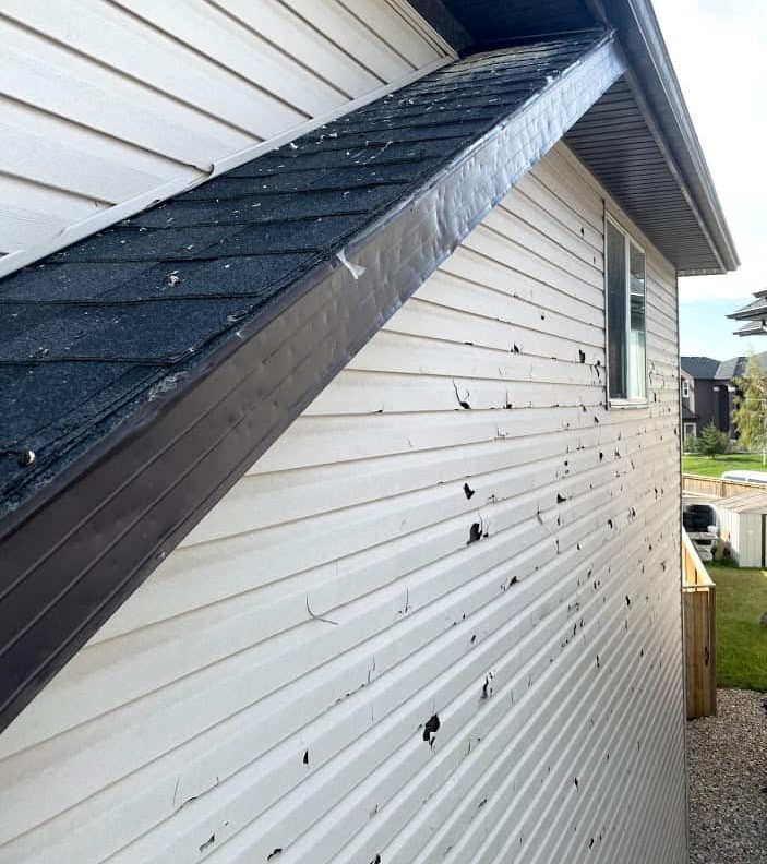 Roof in NE Calgary showing storm damage from a hail storm.