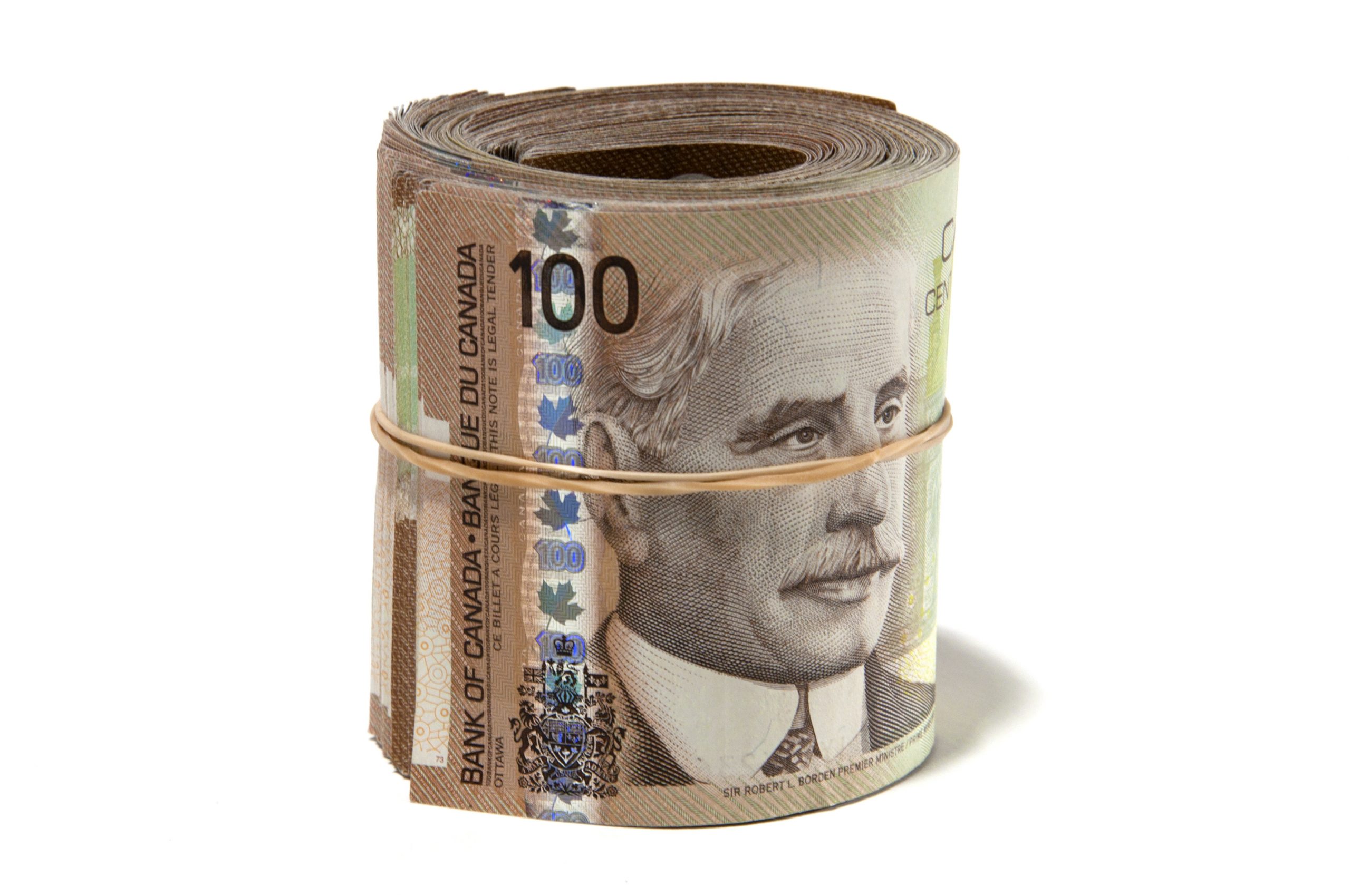 rolled canadian 100 dollar bills illustrating cost