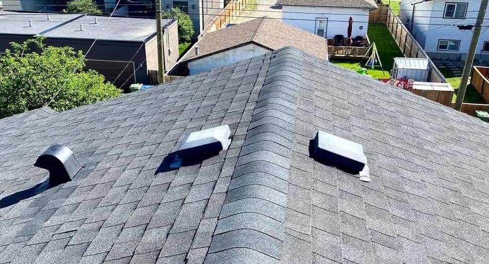 Nail being lifted from roof damage around the flashing on a skylight