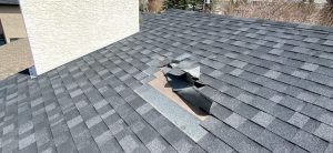 Shingles coming off of a improperly installed roof in Calgary.,