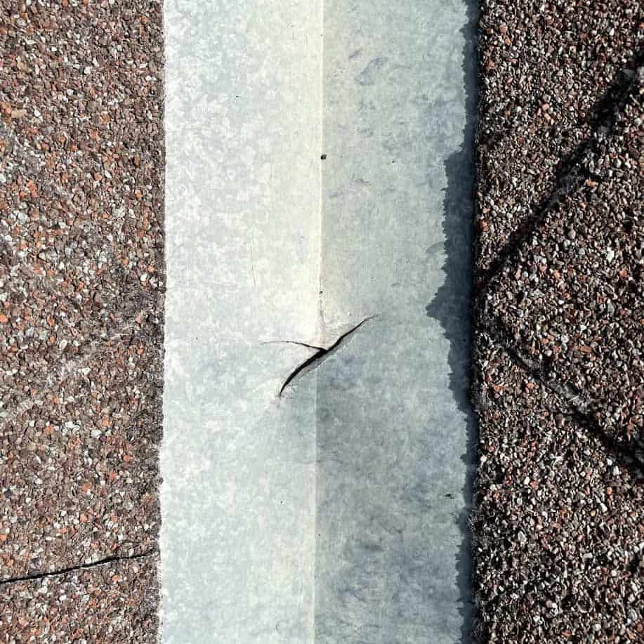 A crack in a roofs flashing in calgary alberta that needs to be repaired