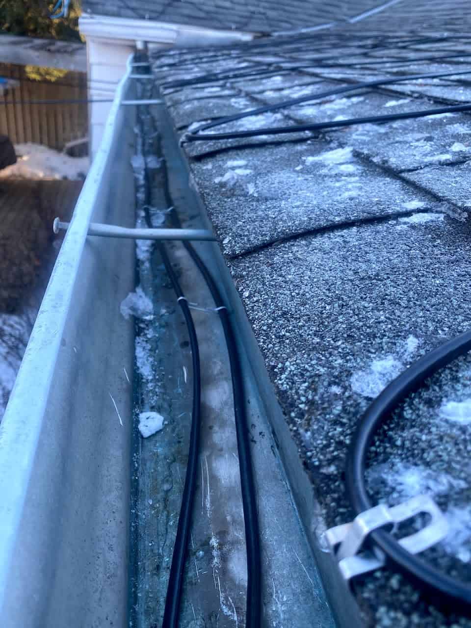 Heat cables on being installed on a roof in Calgary