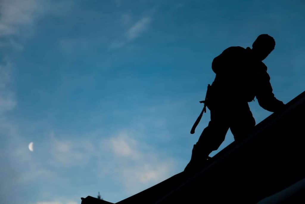 silhouette of a roofer