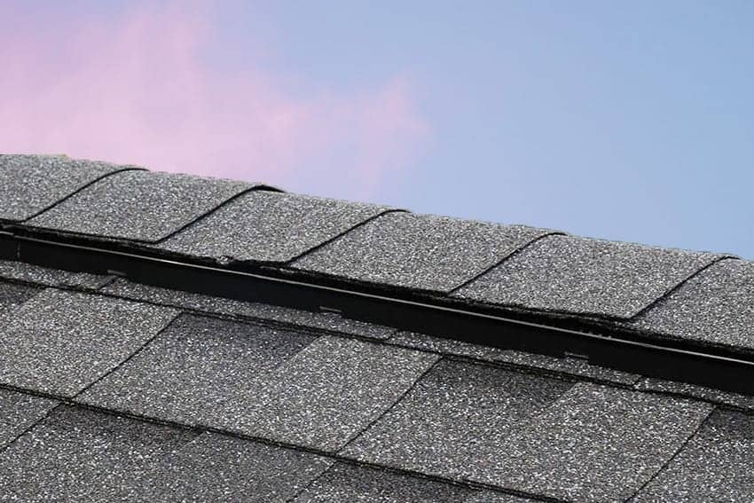 close up of a ridge vent with sky in the background