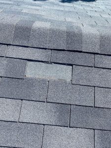 A missing shingle from a roof inspection on a calgary home.