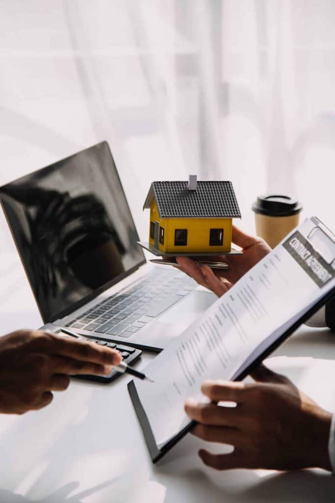 Real estate broker agent presenting and consult to customer to decision making sign insurance form agreement, buy and sell home model, concerning mortgage loan offer for and house insurance