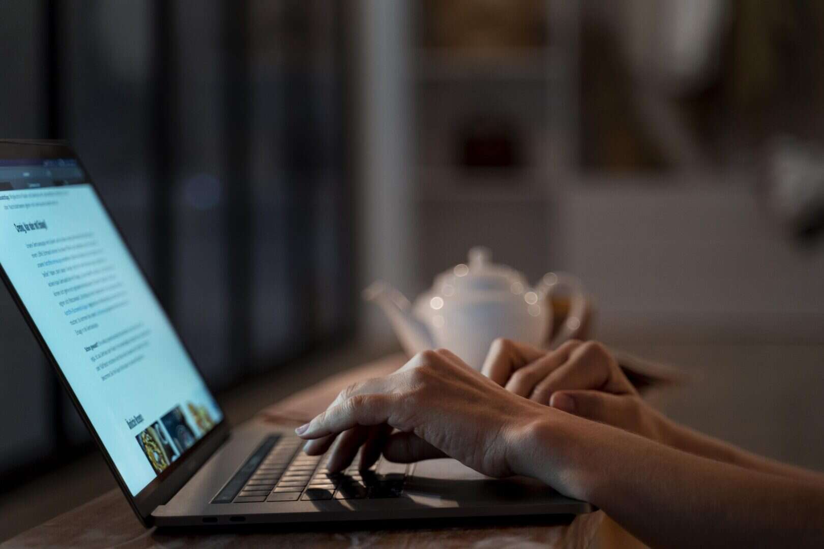 A person doing research on her computer to make sure a company is legit.